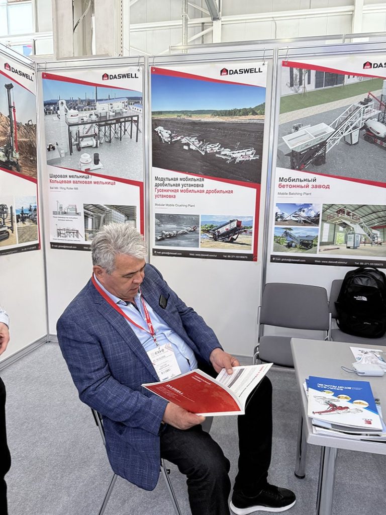 A potential buyer reviewing Daswell’s product catalog at our booth.